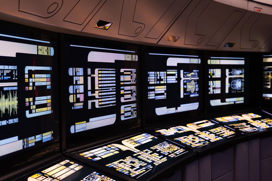 A high-tech command center with illuminated digital screens in a futuristic setting.